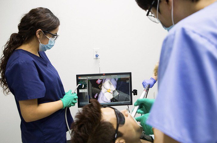 Dentist capturing intraoral photos